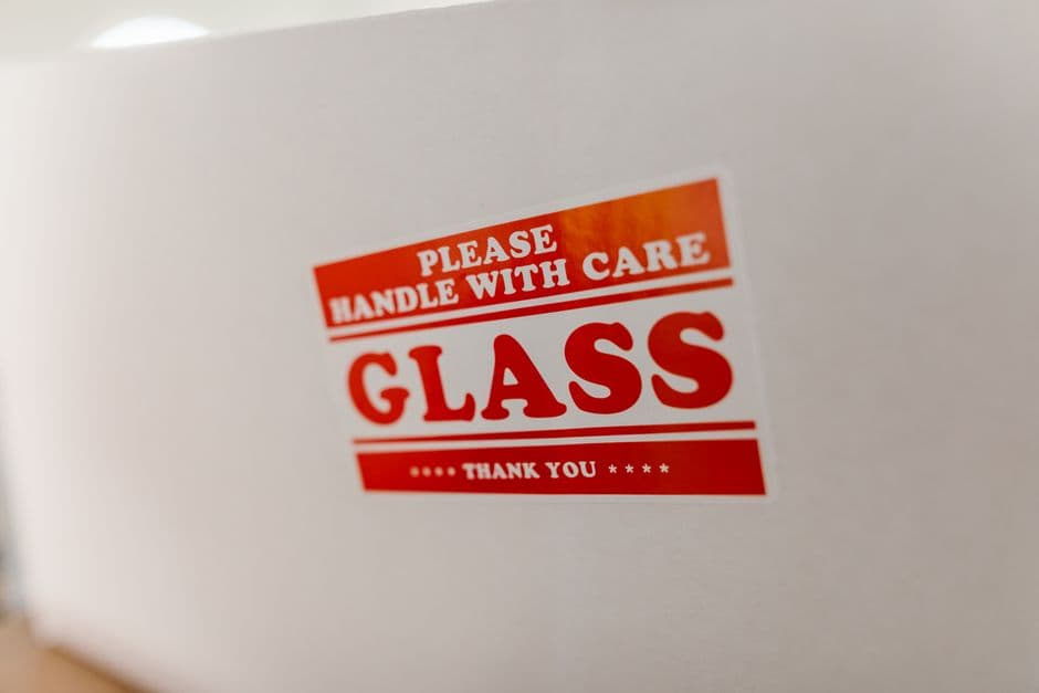 A close-up of a packaging label printed with a handling and safety warning.